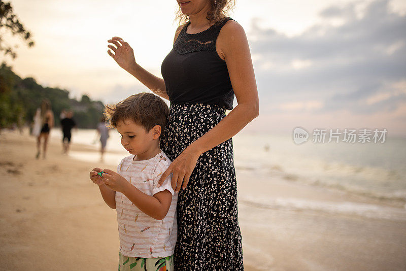 Woman and son on the beach